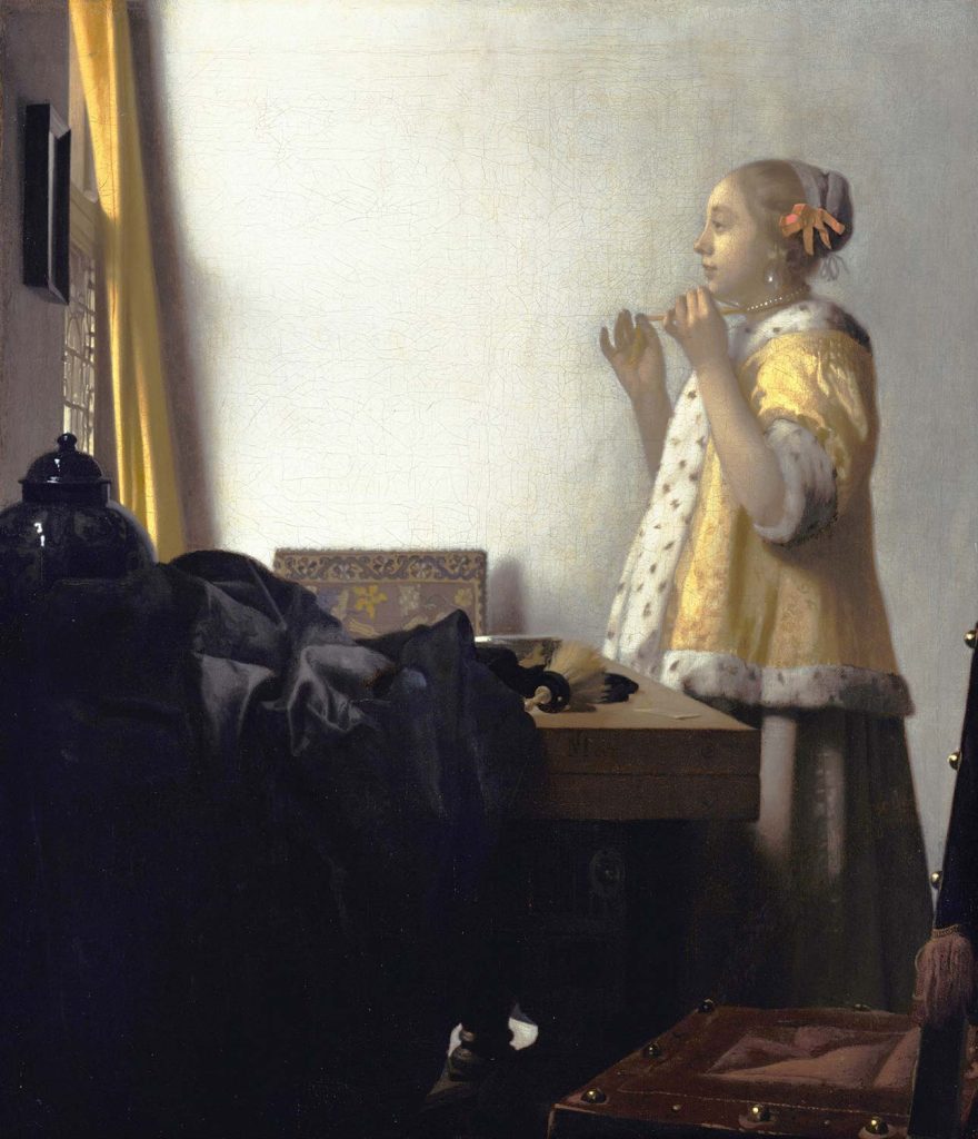 Woman with a Pearl Necklace by Johannes Vermeer